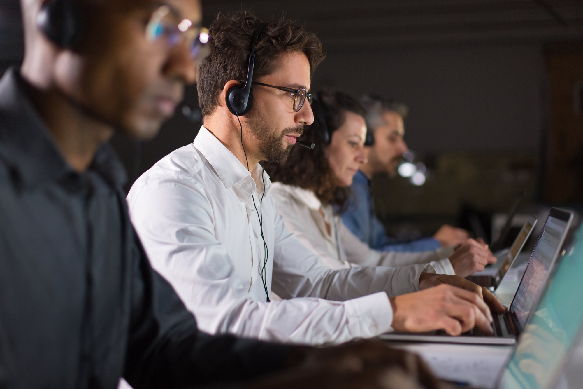 confident-call-center-operator-talking-with-client confident-call-center-operator-talking-with-client